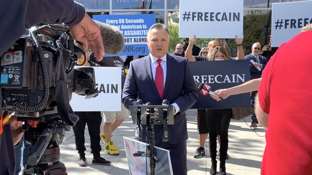 Patrick Steinfeld giving a news conference