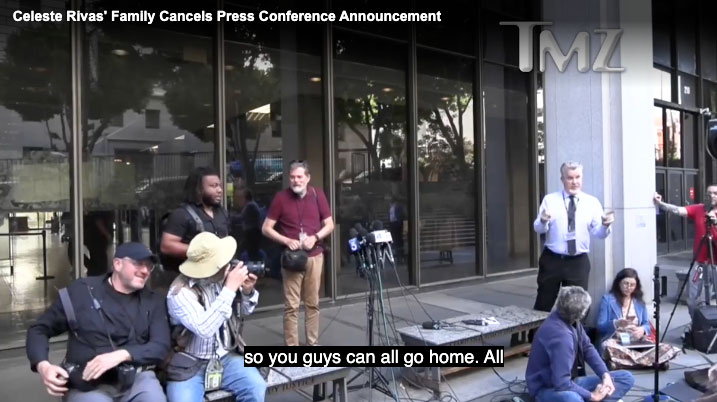 Media and press surrounding an empty table outside of an LA courthouse