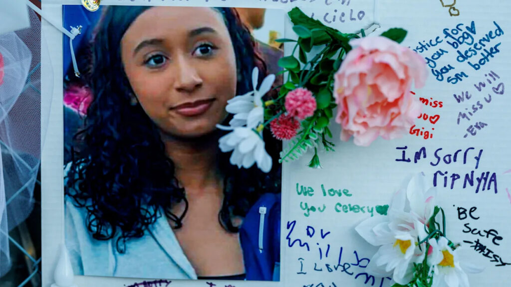 A photo of Celeste Rivas Hernandez, flowers, and writing as part of a memorial