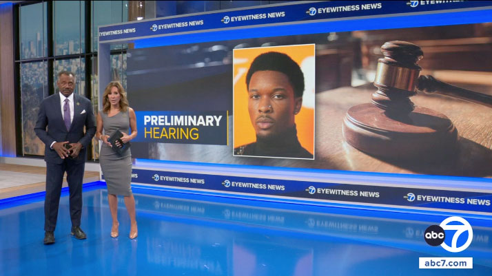 A male and female reporter standing in front of a screen with D4vd's face and a gavel